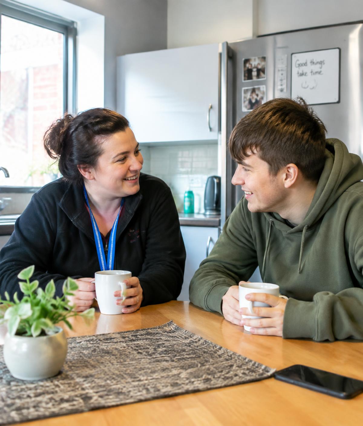 Support worker chatting with a tenant